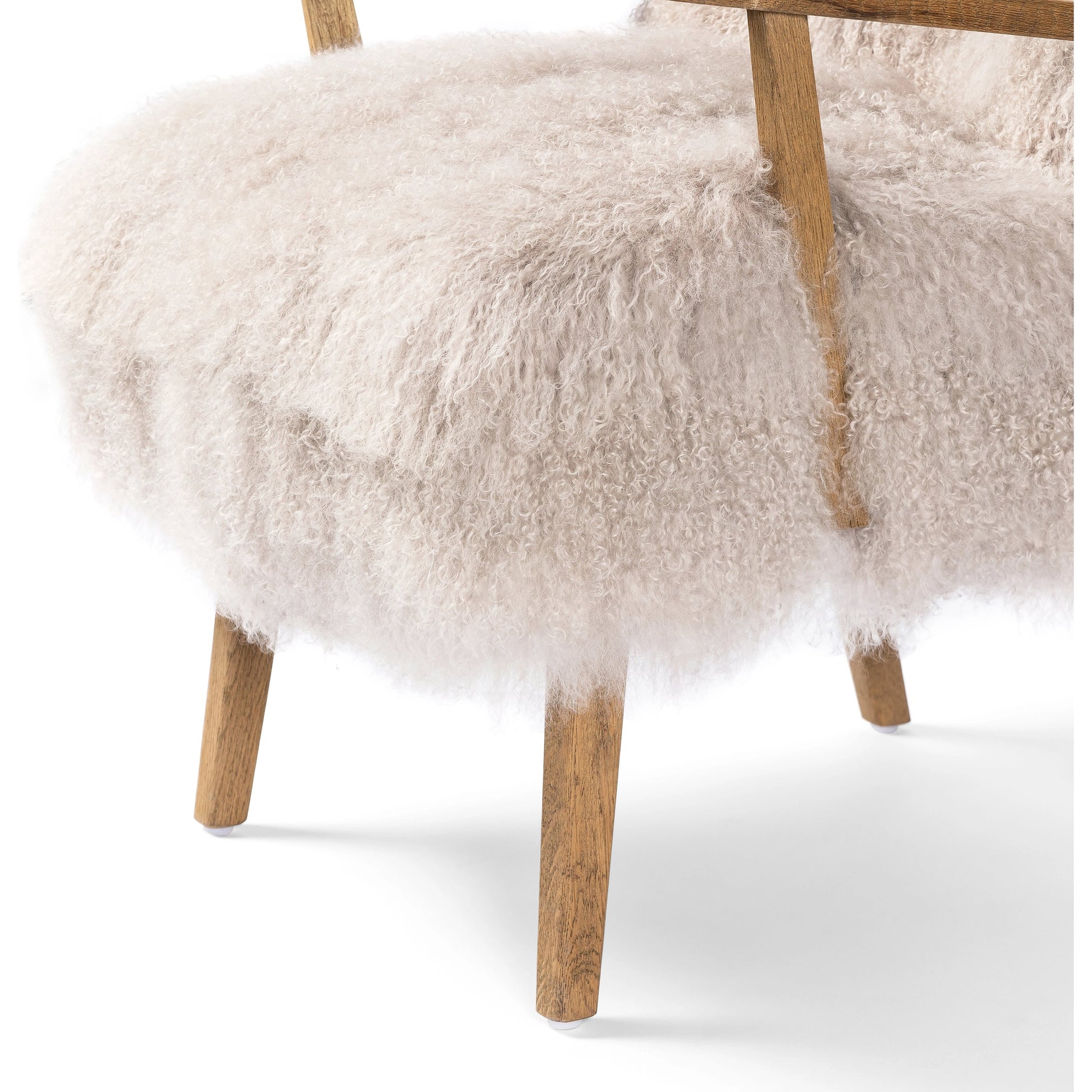 Ashland Armchair by Four Hands in mongolia cream fur, drifted oak. Made from mongolia fur, solid oak, 100% polyester in a modern style.