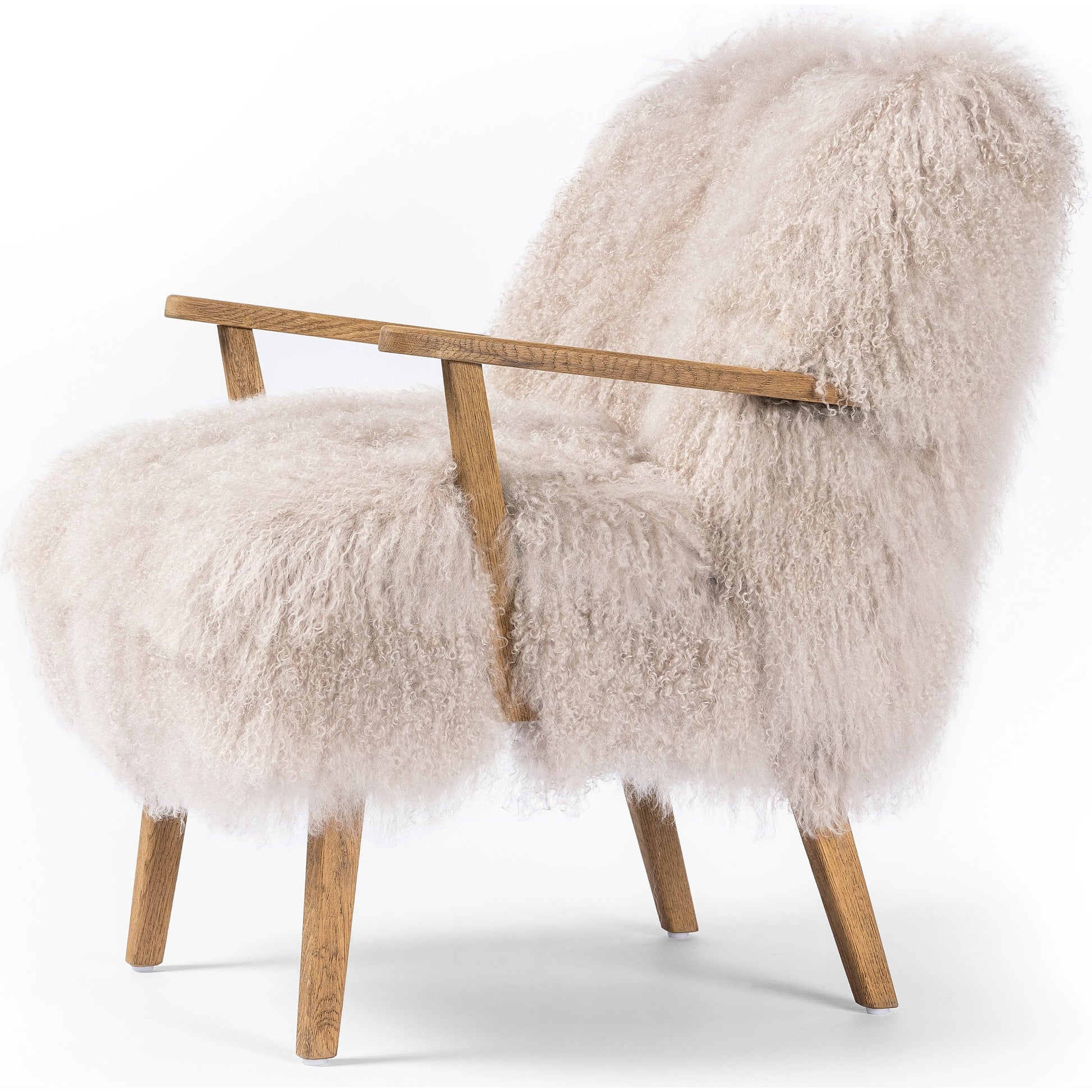 Ashland Armchair by Four Hands in mongolia cream fur, drifted oak. Made from mongolia fur, solid oak, 100% polyester in a modern style.