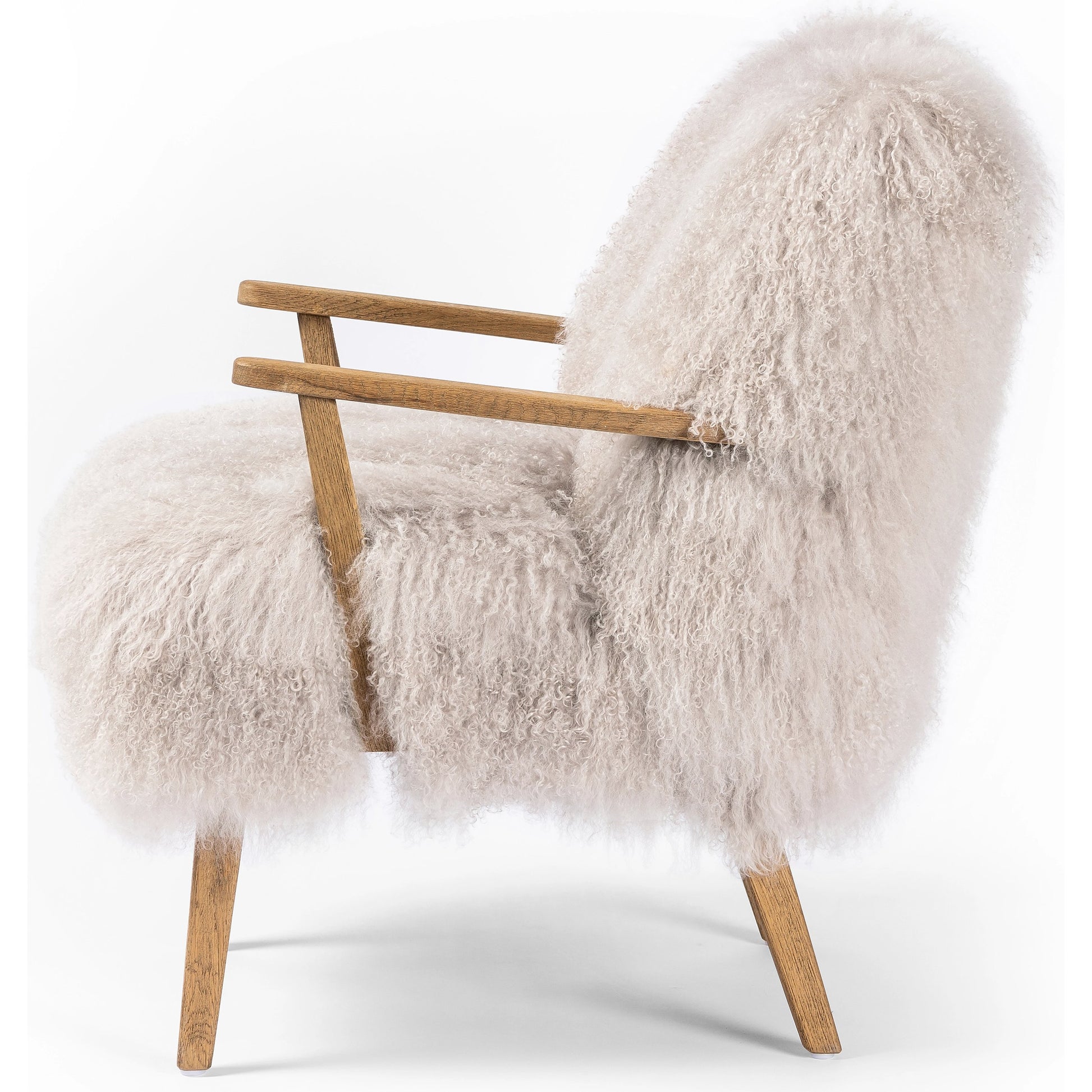 Ashland Armchair by Four Hands in mongolia cream fur, drifted oak. Made from mongolia fur, solid oak, 100% polyester in a modern style.