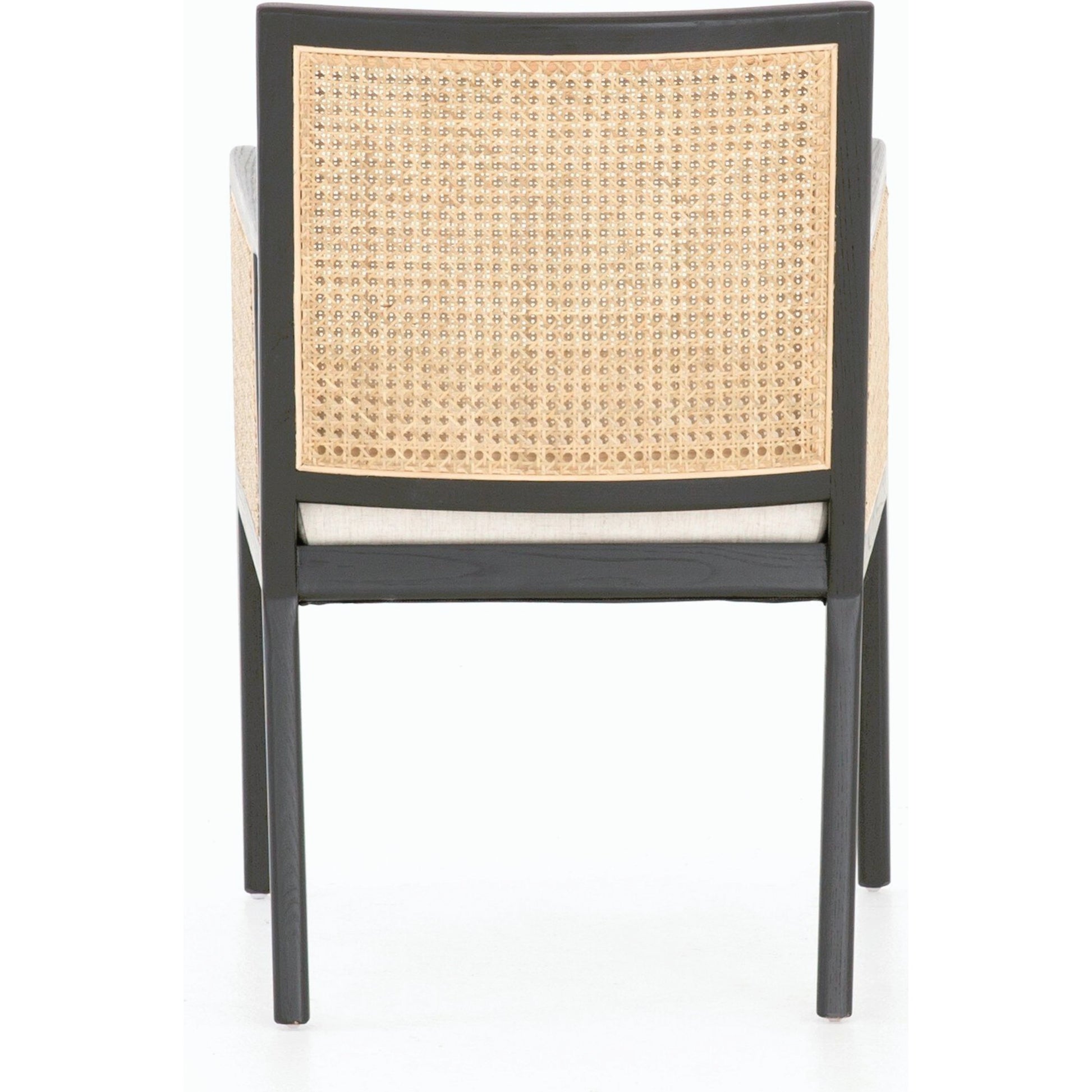 Antonia Cane Dining Armchair by Four Hands in light natural cane, brushed ebony, savile flax. Made from 92% polyester, 8% flax, linen, solid nettlewood, cane in a modern style.