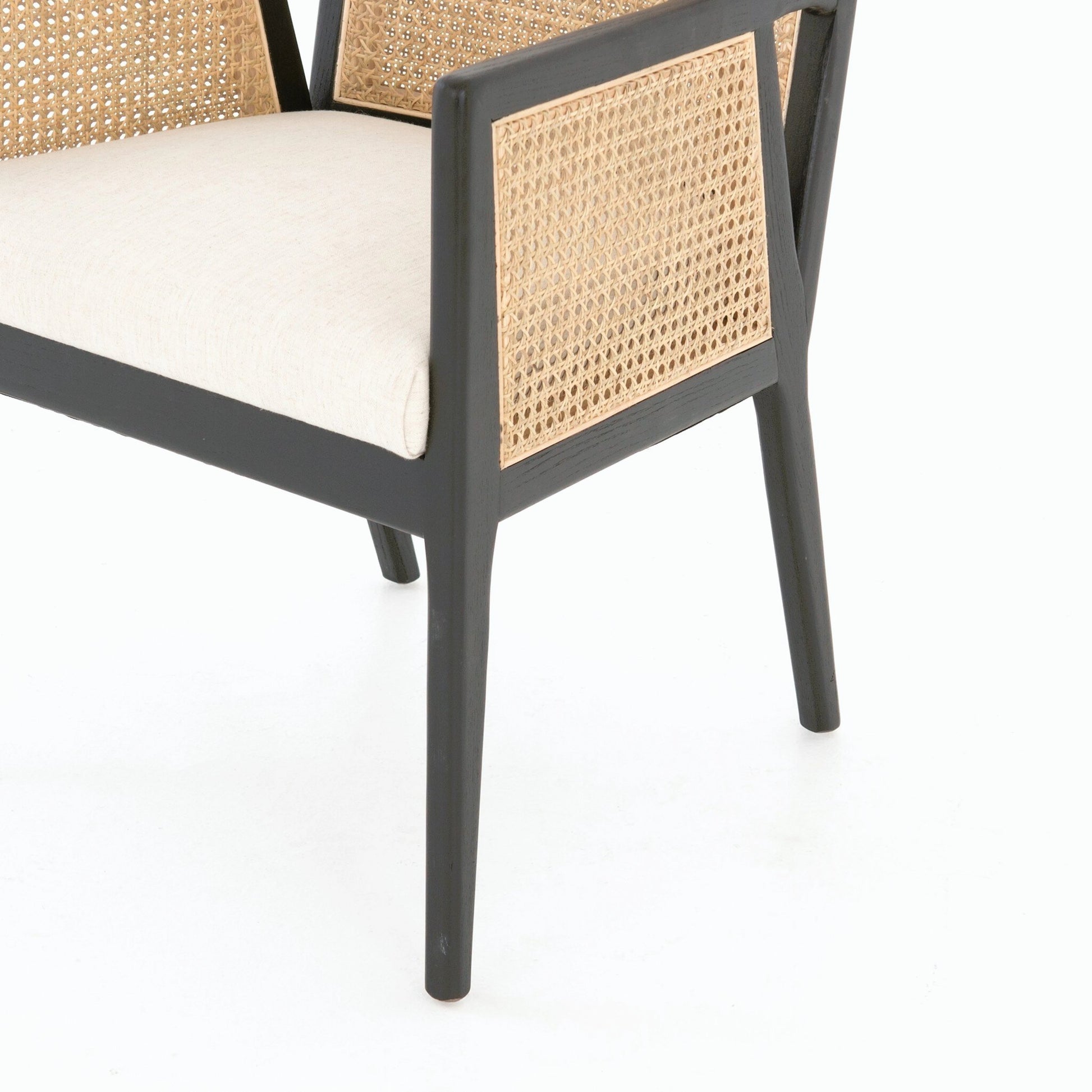Antonia Cane Dining Armchair by Four Hands in light natural cane, brushed ebony, savile flax. Made from 92% polyester, 8% flax, linen, solid nettlewood, cane in a modern style.