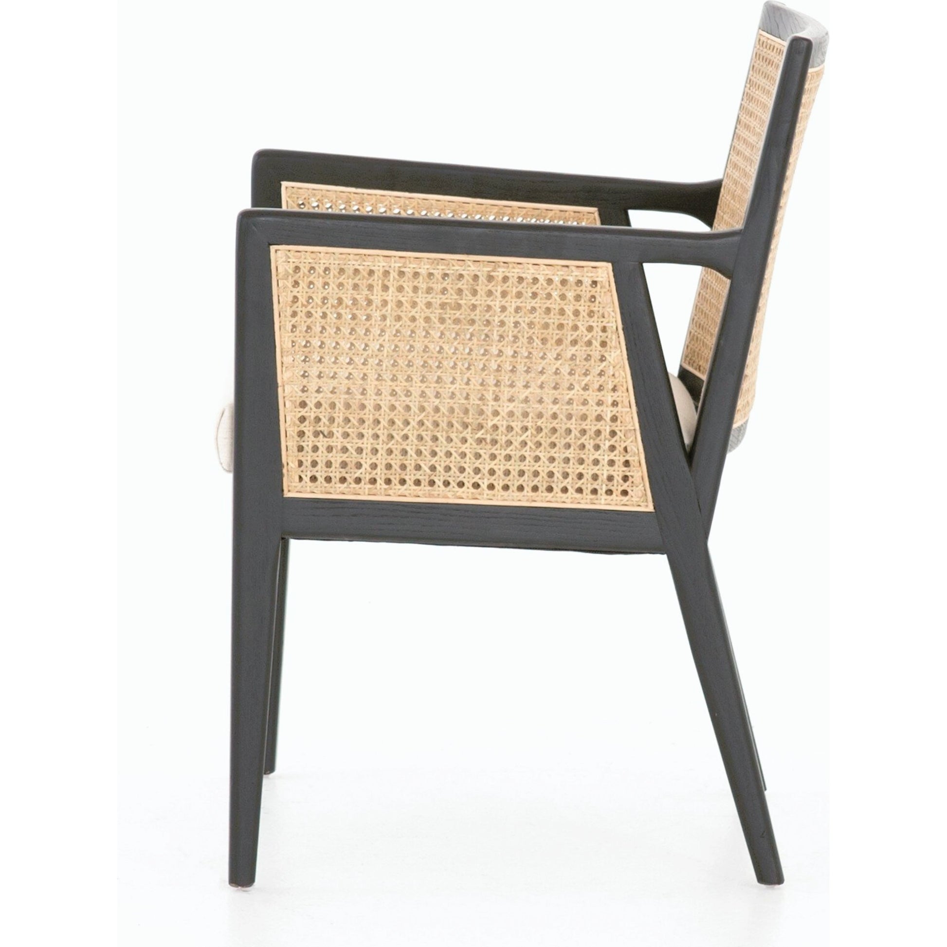 Antonia Cane Dining Armchair by Four Hands in light natural cane, brushed ebony, savile flax. Made from 92% polyester, 8% flax, linen, solid nettlewood, cane in a modern style.