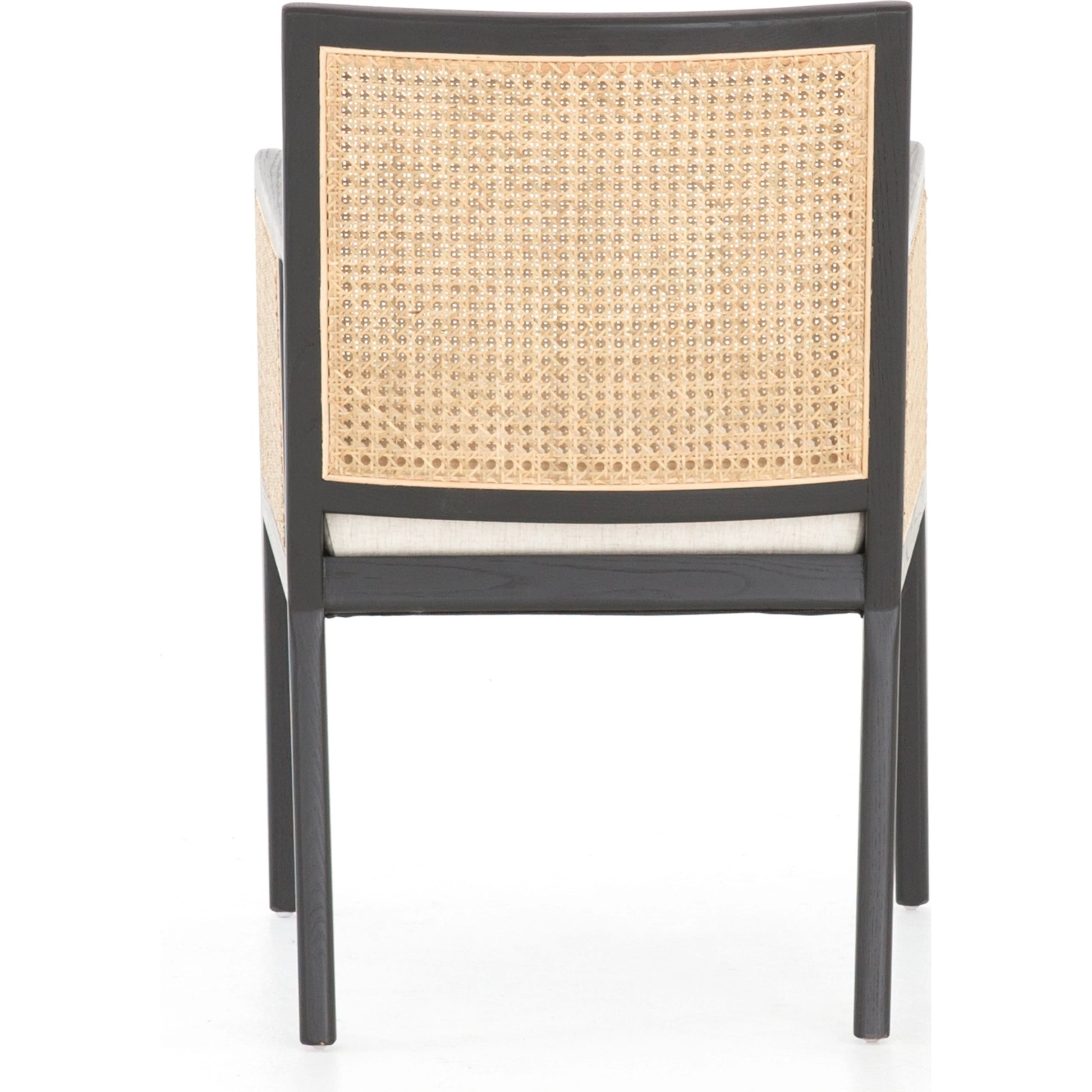 Antonia Cane Dining Armchair by Four Hands in light natural cane, brushed ebony, savile flax. Made from 92% polyester, 8% flax, linen, solid nettlewood, cane in a modern style.