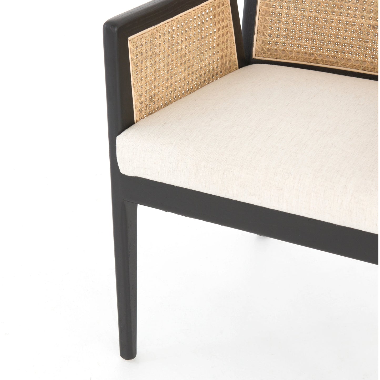 010 SI-1980070 | Closeup | Antonia Cane Dining Armchair by Four Hands in light natural cane, brushed ebony, savile flax. Made from 92% polyester, 8% flax, linen, solid nettlewood, cane in a modern style.
