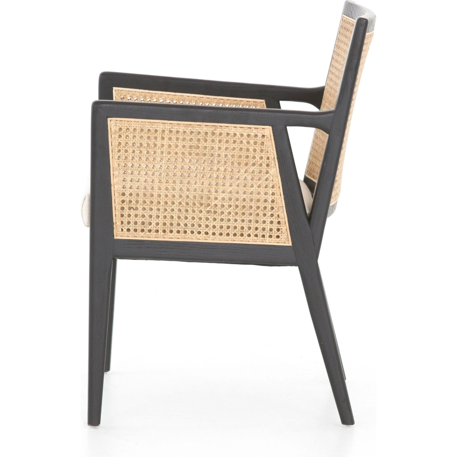 Antonia Cane Dining Armchair by Four Hands in light natural cane, brushed ebony, savile flax. Made from 92% polyester, 8% flax, linen, solid nettlewood, cane in a modern style.