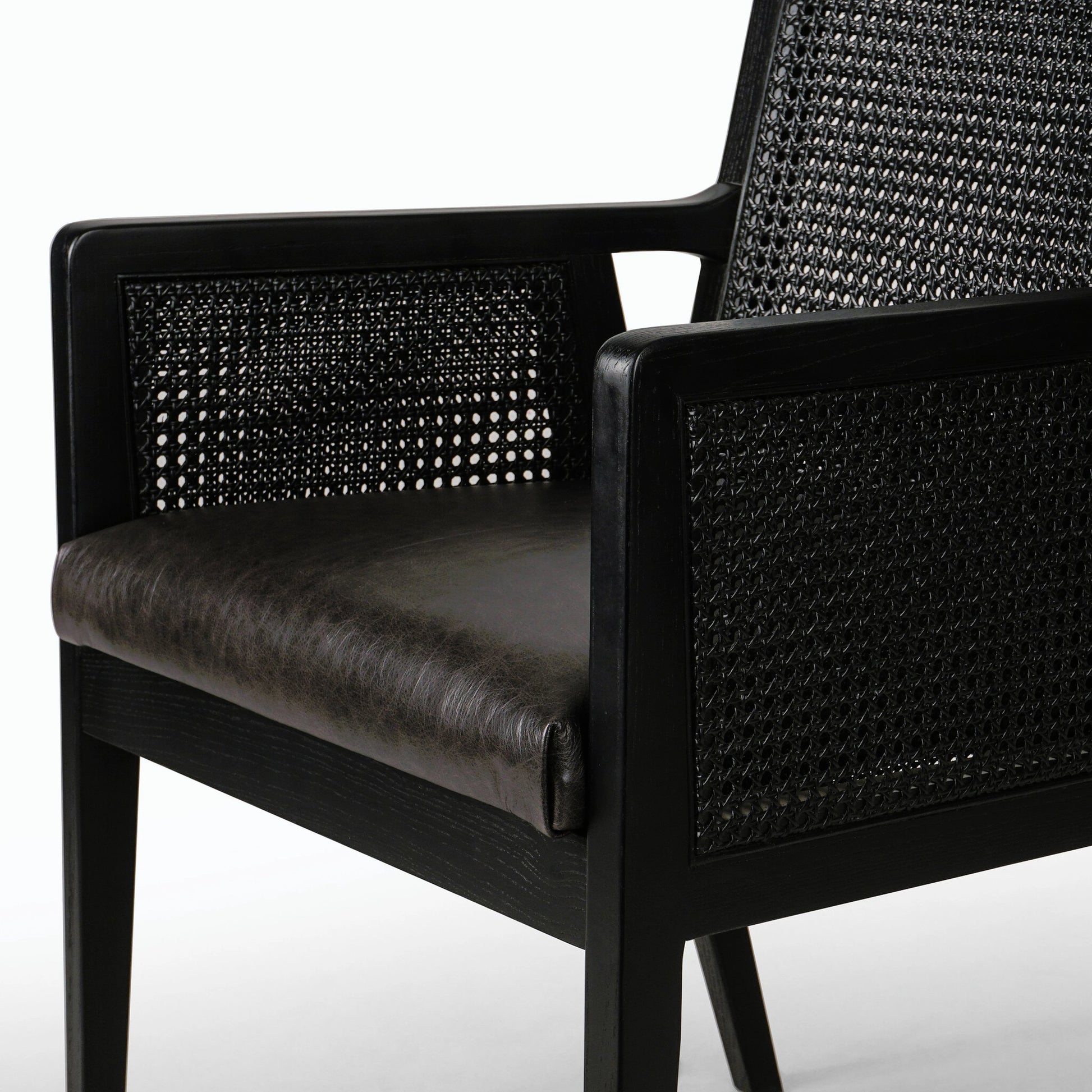 Antonia Cane Dining Armchair by Four Hands in light natural cane, brushed ebony, savile flax. Made from 92% polyester, 8% flax, linen, solid nettlewood, cane in a modern style.