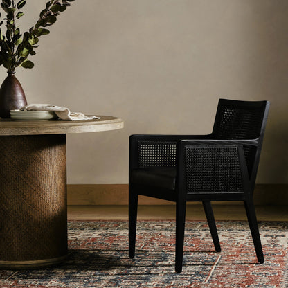 Antonia Cane Dining Armchair by Four Hands in light natural cane, brushed ebony, savile flax. Made from 92% polyester, 8% flax, linen, solid nettlewood, cane in a modern style.