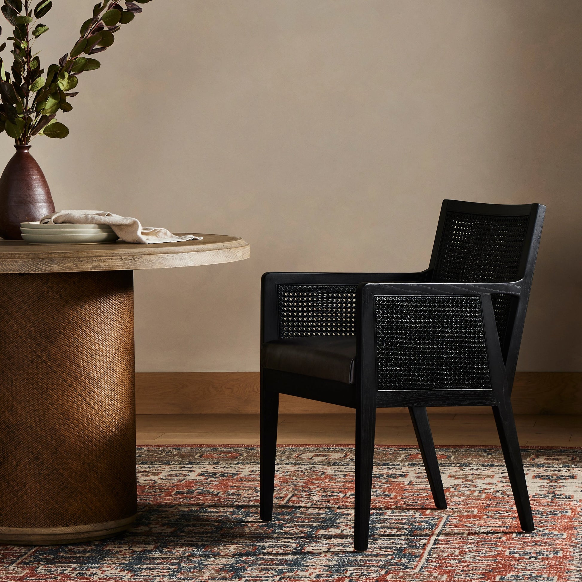 Antonia Cane Dining Armchair by Four Hands in light natural cane, brushed ebony, savile flax. Made from 92% polyester, 8% flax, linen, solid nettlewood, cane in a modern style.