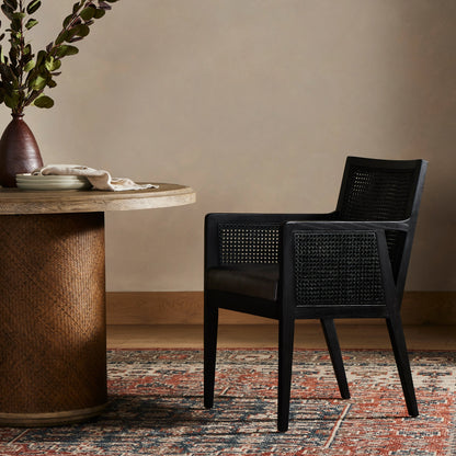 Antonia Cane Dining Armchair by Four Hands in light natural cane, brushed ebony, savile flax. Made from 92% polyester, 8% flax, linen, solid nettlewood, cane in a modern style.