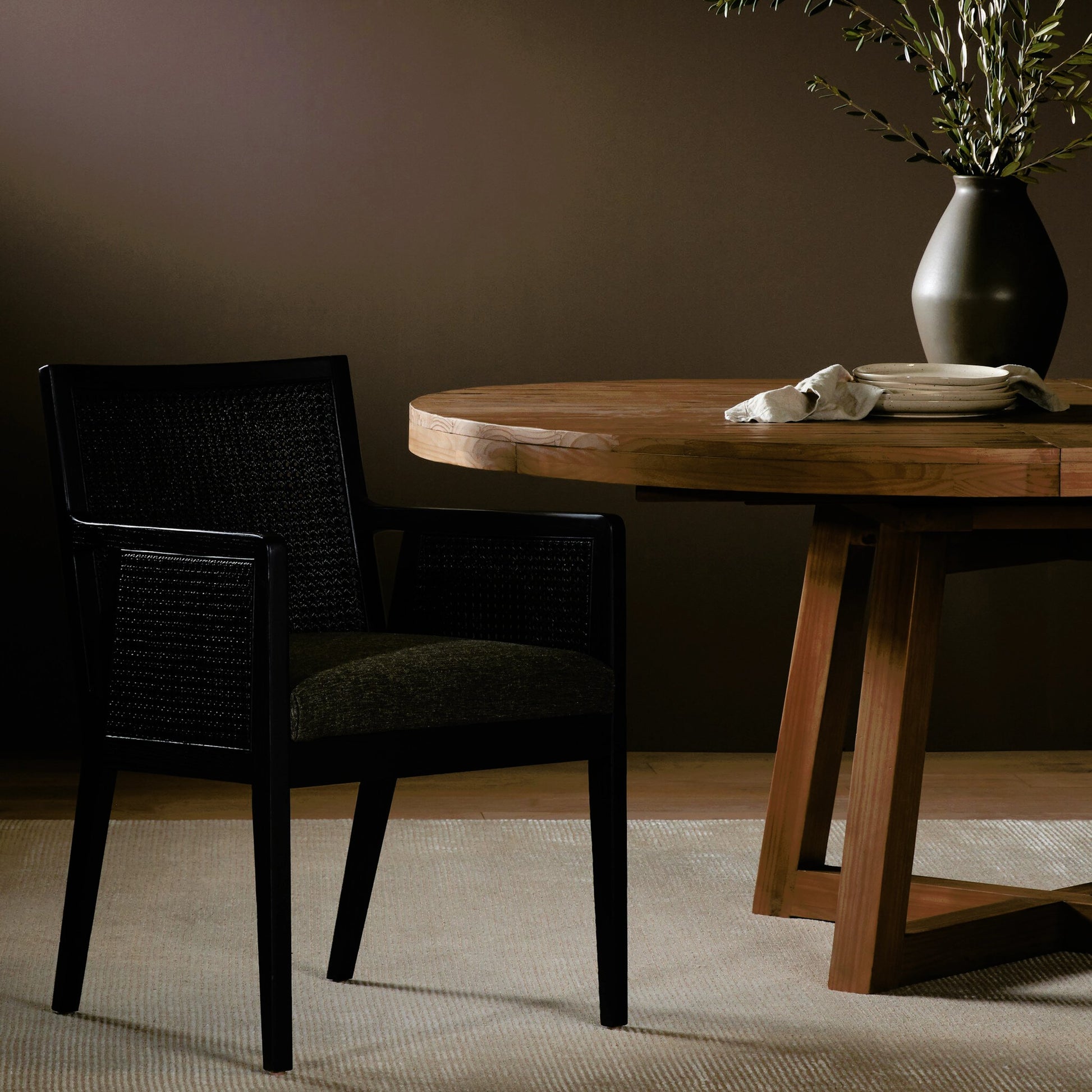 Antonia Cane Dining Armchair by Four Hands in light natural cane, brushed ebony, savile flax. Made from 92% polyester, 8% flax, linen, solid nettlewood, cane in a modern style.