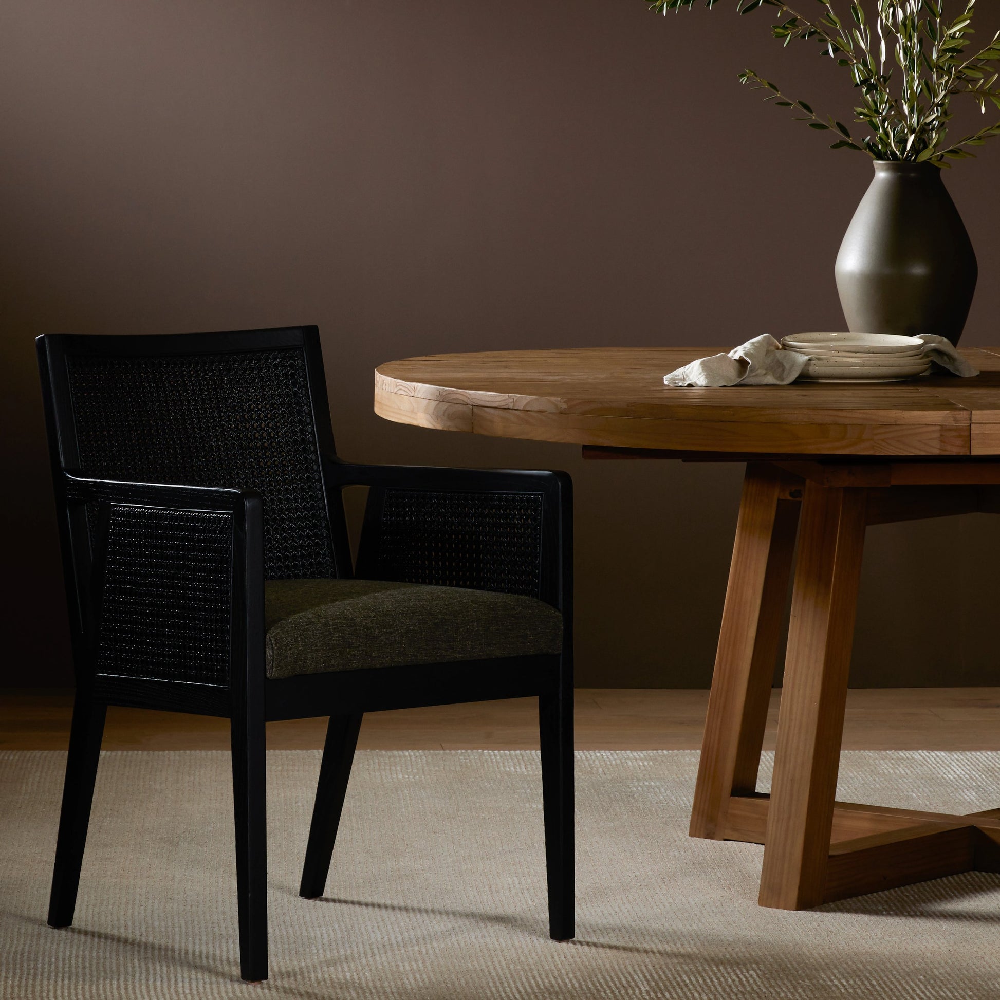 Antonia Cane Dining Armchair by Four Hands in light natural cane, brushed ebony, savile flax. Made from 92% polyester, 8% flax, linen, solid nettlewood, cane in a modern style.