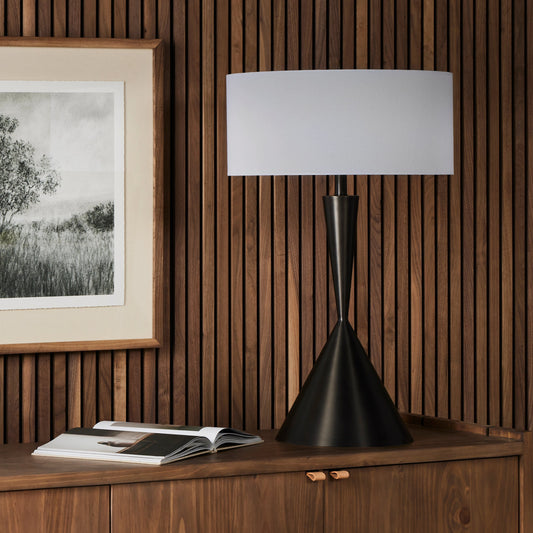 Clement Table Lamp by Four Hands in aged antique brass. Made from brass, 100% cotton, thermoplastic in a modern style.