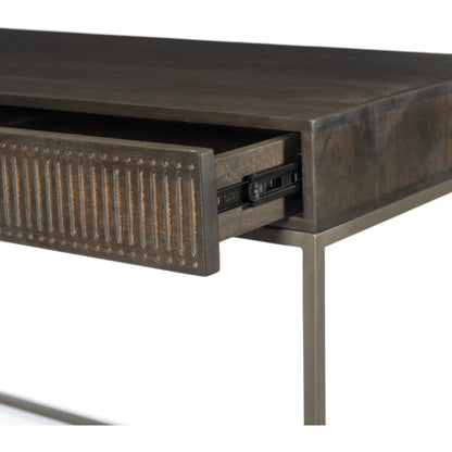 Kelby Writing Desk by Four Hands in aged brass, carved vintage brown, vintage brown, gunmetal and vintage brown. Made from solid mango, iron in a modern style.
