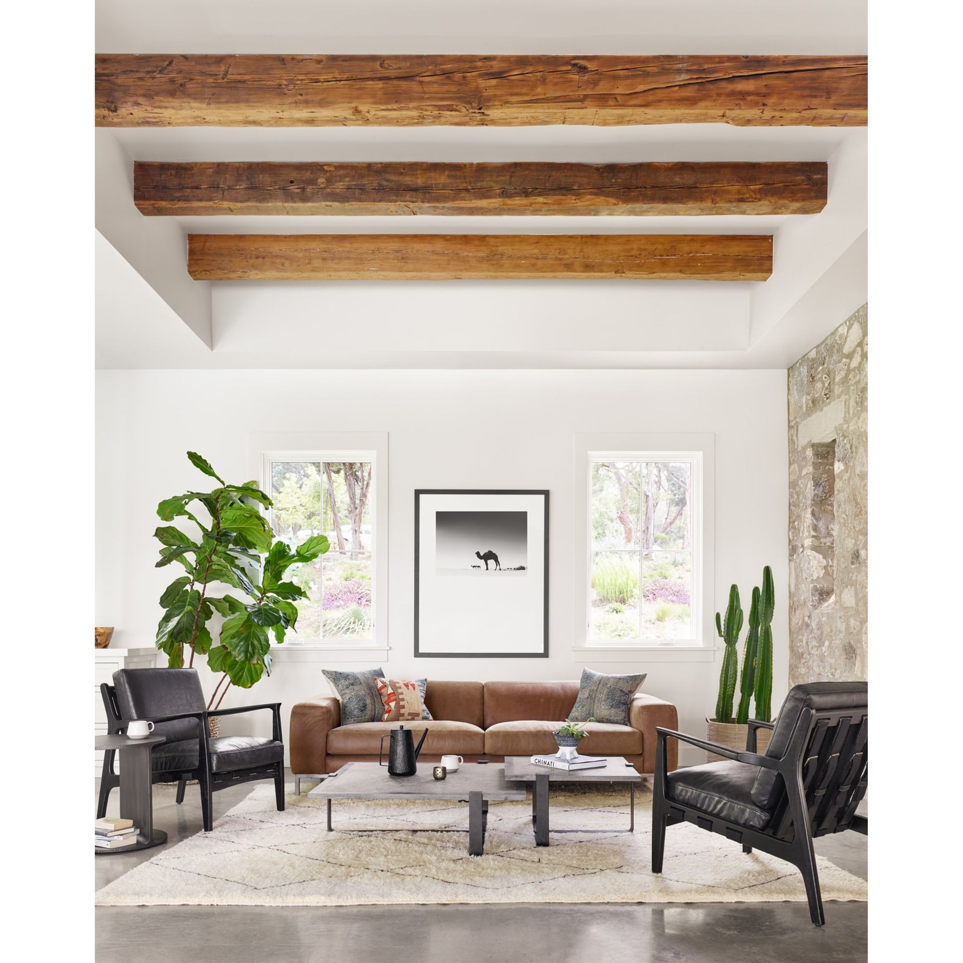 Griffon Side Table by Four Hands in rustic fossil. Made from iron in a modern style.