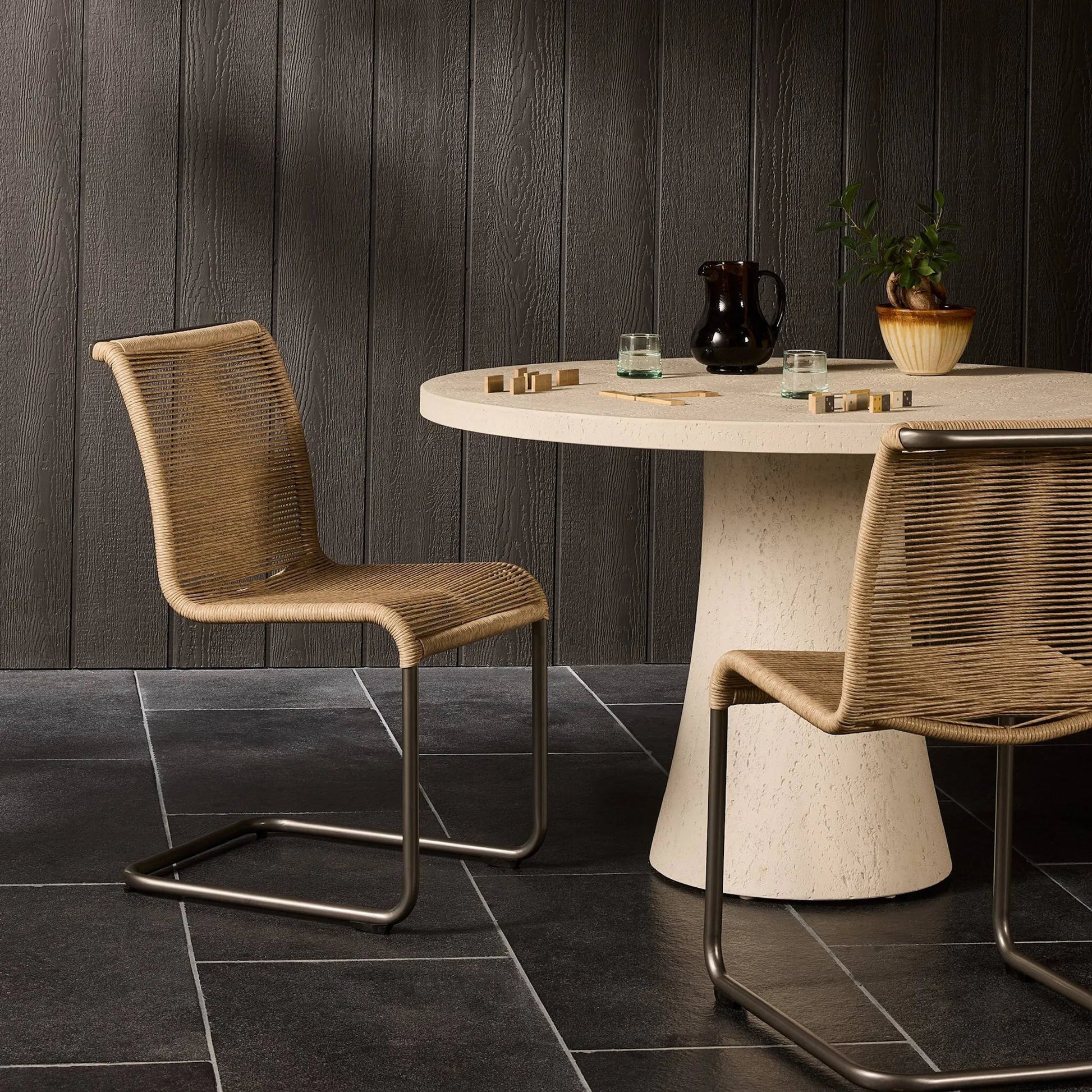 Grover Outdoor Dining Chair by Four Hands. Made from iron, 100% polyethylene in a coastal style.