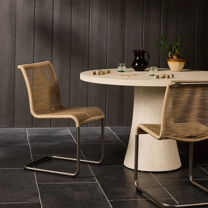 Grover Outdoor Dining Chair by Four Hands. Made from iron, 100% polyethylene in a coastal style.