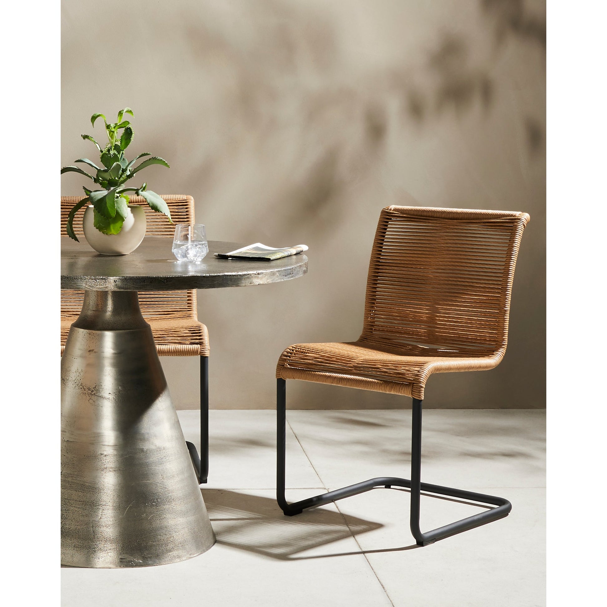 Grover Outdoor Dining Chair by Four Hands. Made from iron, 100% polyethylene in a coastal style.