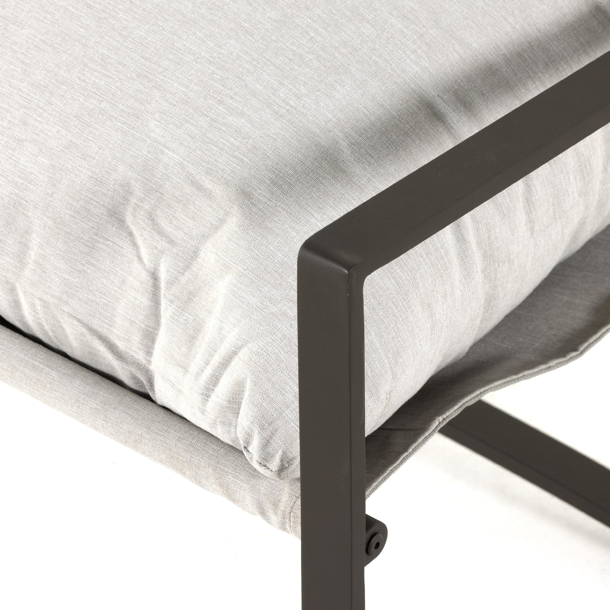 Avon Outdoor Sling Chair by Four Hands in faye sand, bronze. Made from 100% olefin, aluminum, 59% polyurethane foam, 30% polyester fiber, 11% polyester fiber batting in a modern style.