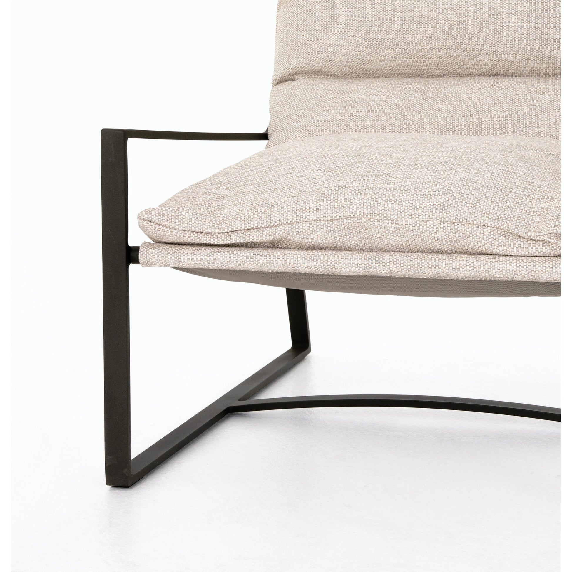 Avon Outdoor Sling Chair by Four Hands in faye sand, bronze. Made from 100% olefin, aluminum, 59% polyurethane foam, 30% polyester fiber, 11% polyester fiber batting in a modern style.