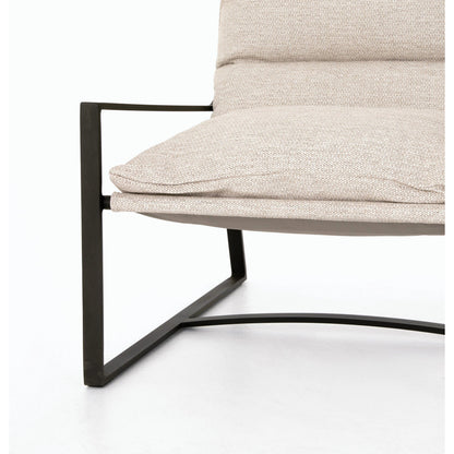 Avon Outdoor Sling Chair by Four Hands in faye sand, bronze. Made from 100% olefin, aluminum, 59% polyurethane foam, 30% polyester fiber, 11% polyester fiber batting in a modern style.