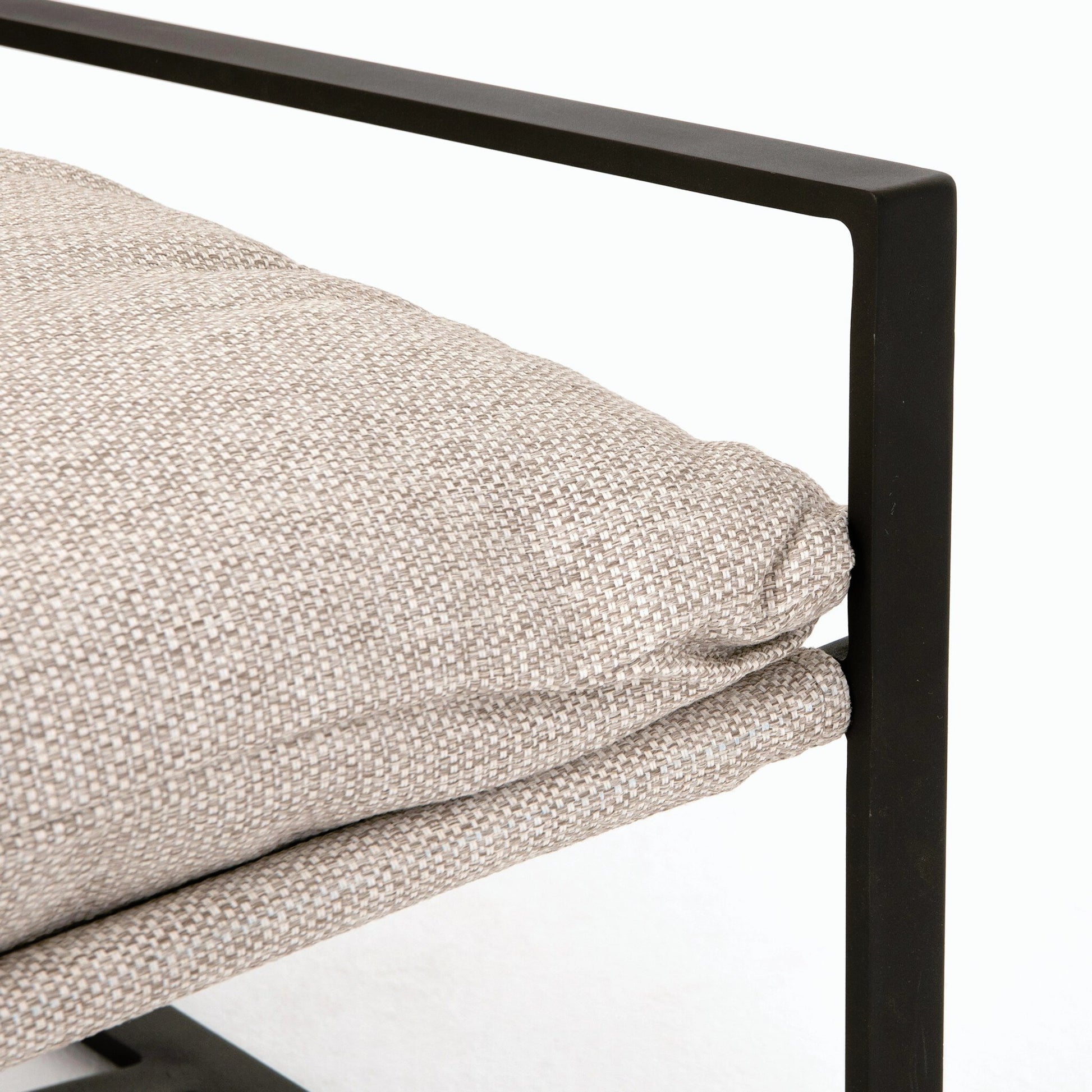 Avon Outdoor Sling Chair by Four Hands in faye sand, bronze. Made from 100% olefin, aluminum, 59% polyurethane foam, 30% polyester fiber, 11% polyester fiber batting in a modern style.