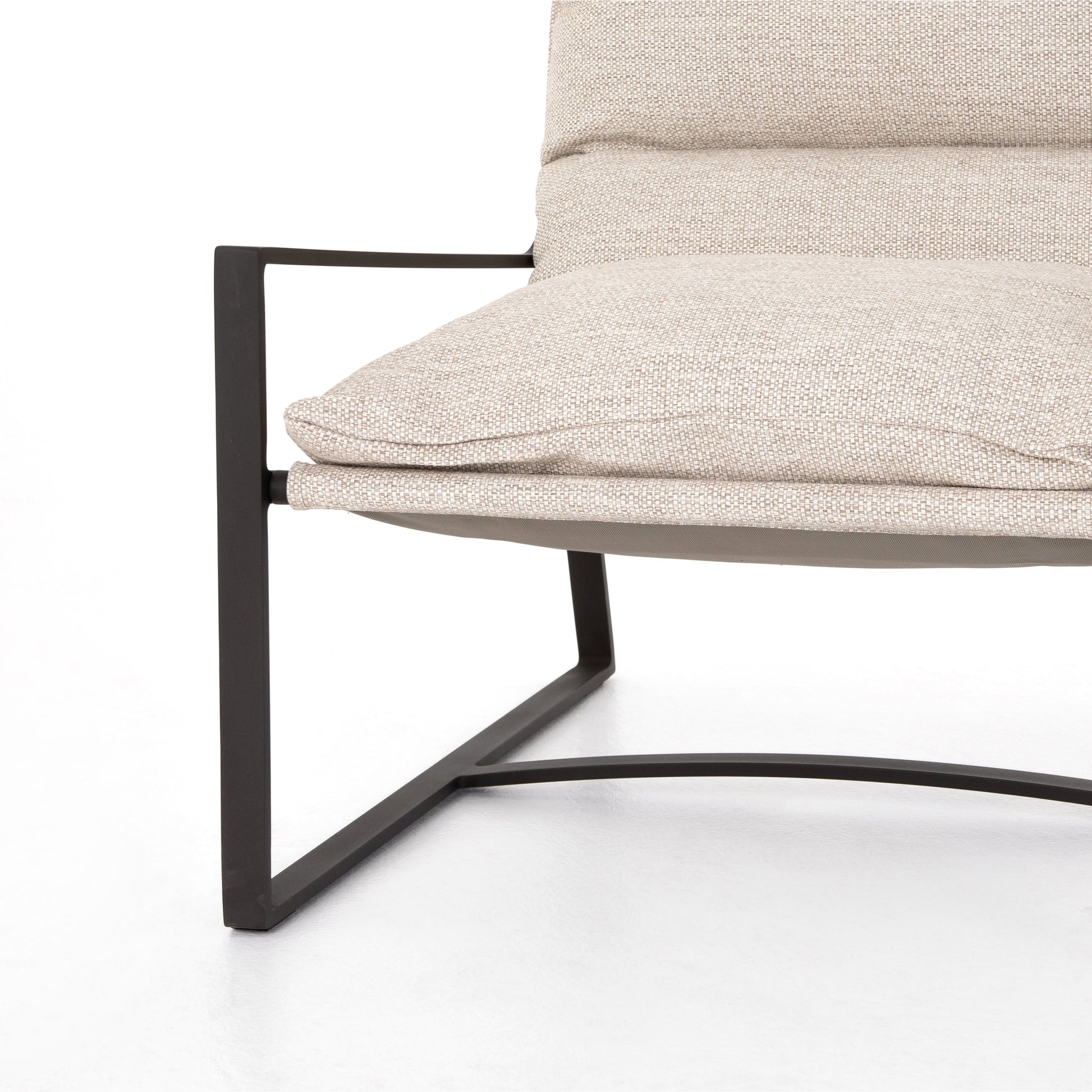 Avon Outdoor Sling Chair by Four Hands in faye sand, bronze. Made from 100% olefin, aluminum, 59% polyurethane foam, 30% polyester fiber, 11% polyester fiber batting in a modern style.