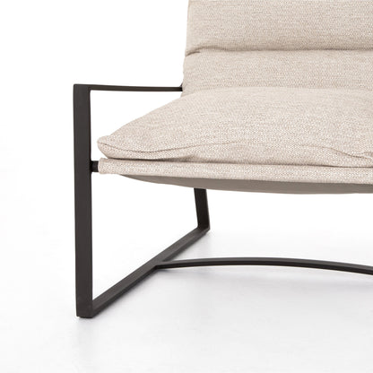 Avon Outdoor Sling Chair by Four Hands in faye sand, bronze. Made from 100% olefin, aluminum, 59% polyurethane foam, 30% polyester fiber, 11% polyester fiber batting in a modern style.