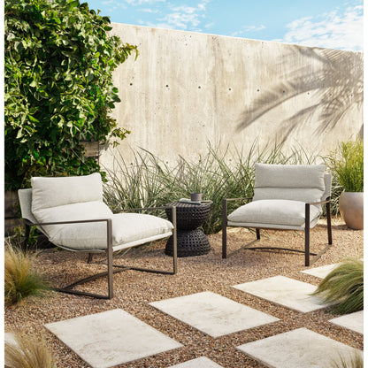 Avon Outdoor Sling Chair by Four Hands in faye sand, bronze. Made from 100% olefin, aluminum, 59% polyurethane foam, 30% polyester fiber, 11% polyester fiber batting in a modern style.