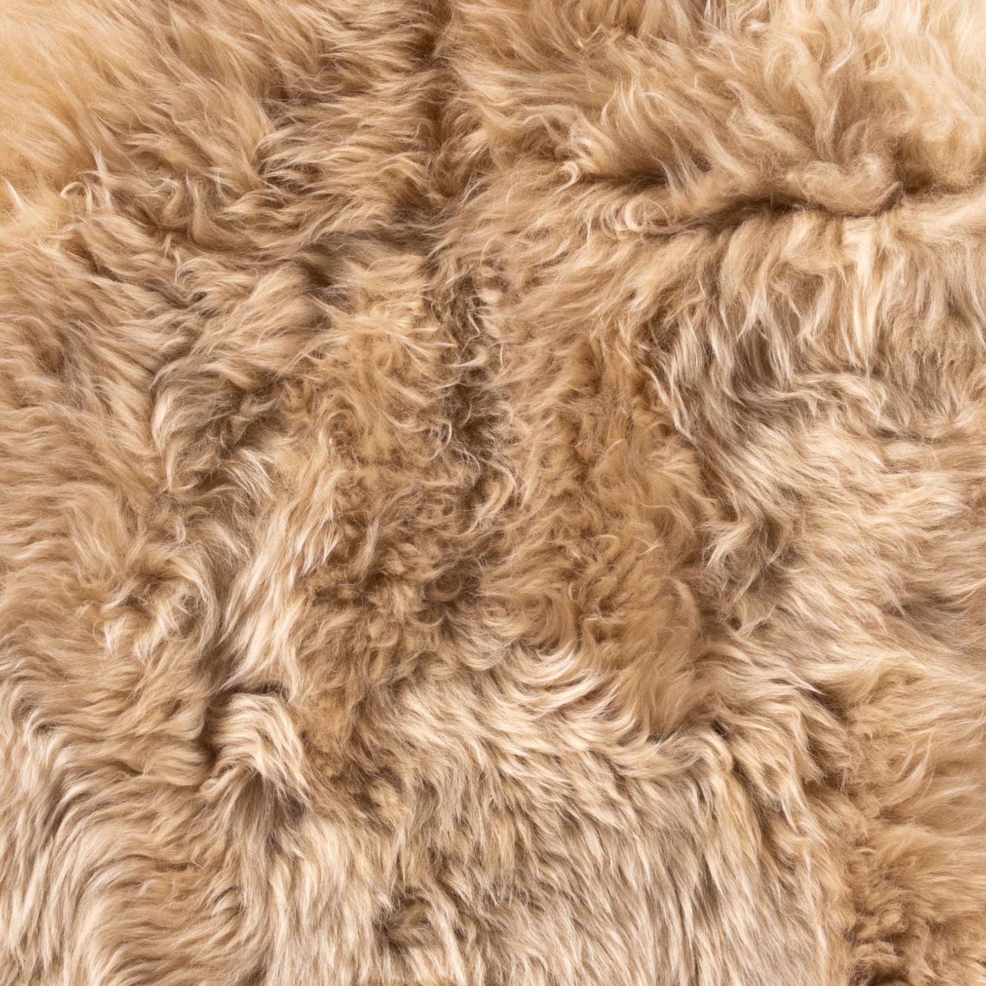 Lalo Lambskin Throw by Four Hands. Made from shearling in a rustic style.