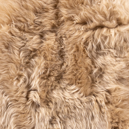 Lalo Lambskin Throw by Four Hands. Made from shearling in a rustic style.