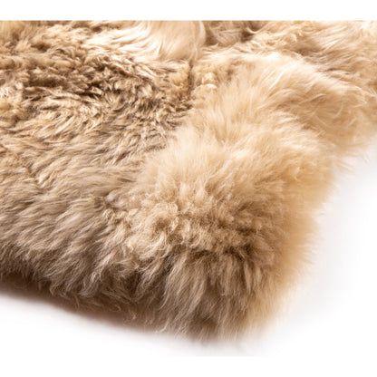 Lalo Lambskin Throw by Four Hands. Made from shearling in a rustic style.