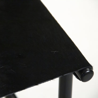 Hide Sling Chair by Zentique in brazilian black cowhide and recycled metal. Made from recycled metal in a modern style.