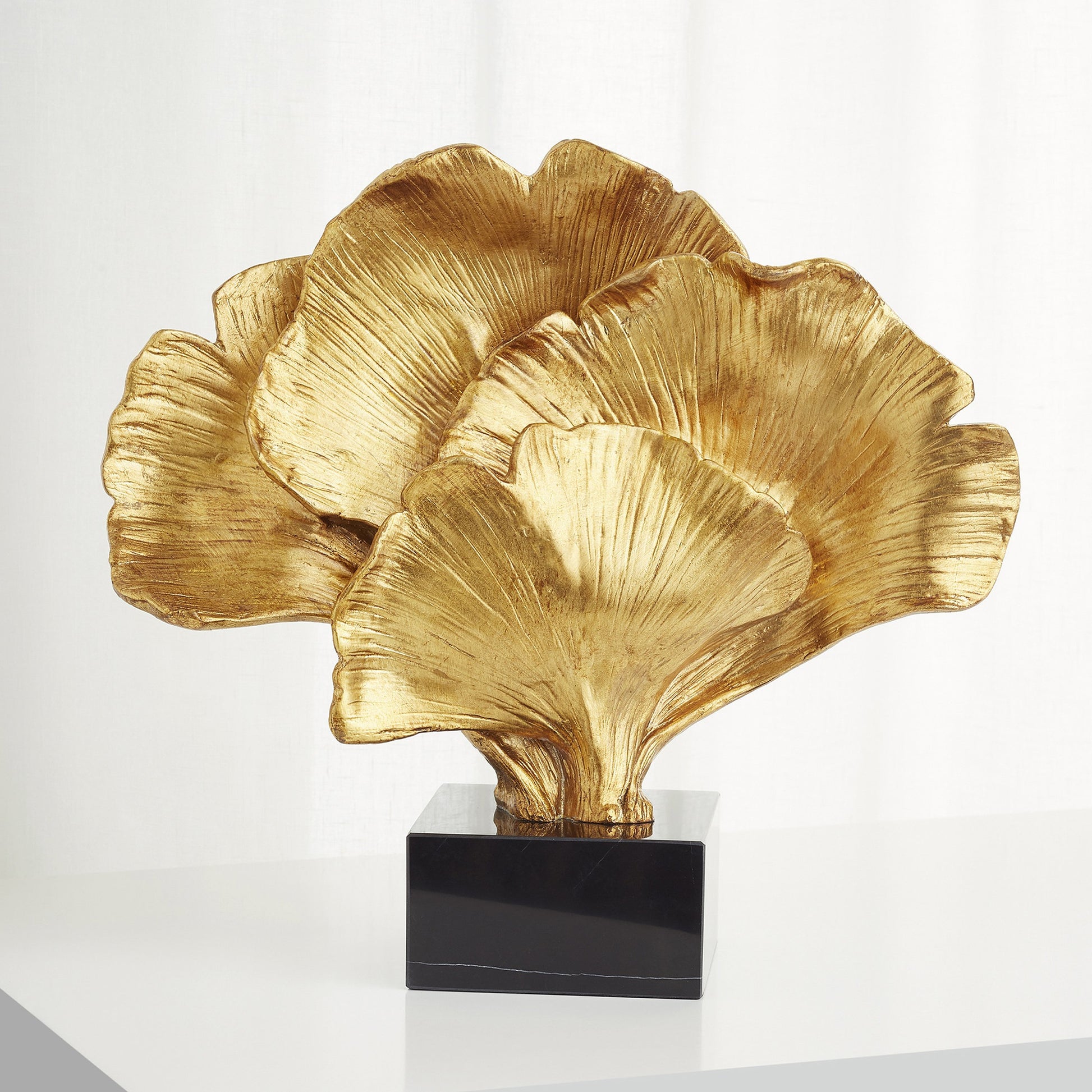Gilded Bloom Sculpture by Cyan Design in gold. Made from resin, marble in a transitional style.