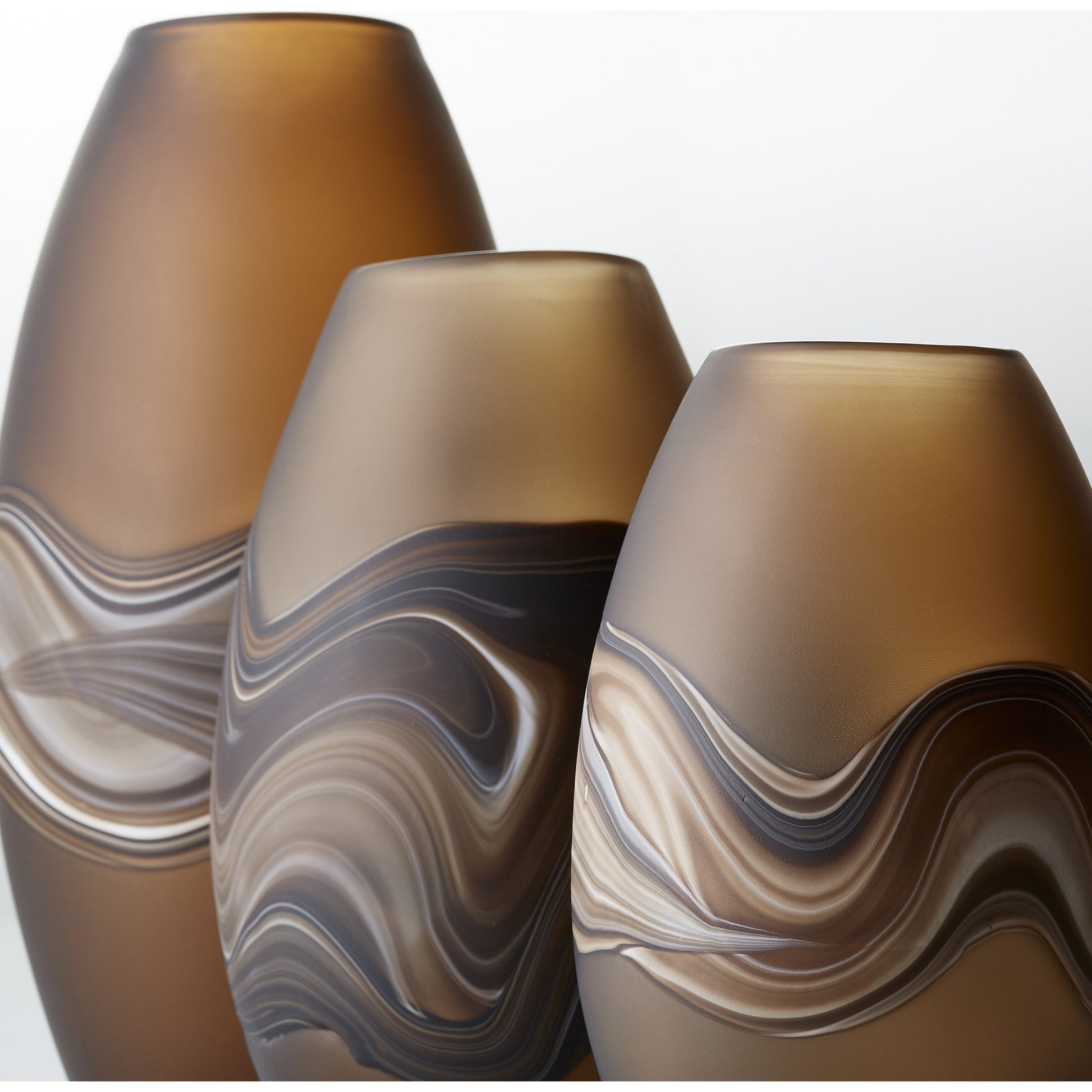 Nina Vase by Cyan Design in amber swirl. Made from glass in a modern style.