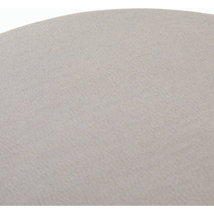 Cyrus Outdoor Round Dining Table by Four Hands. Made from lavastone composite, iron in a modern style.