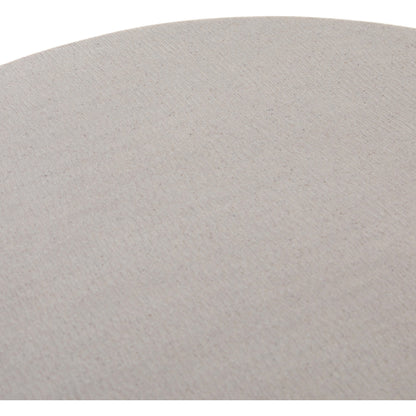 Cyrus Outdoor Round Dining Table by Four Hands. Made from lavastone composite, iron in a modern style.