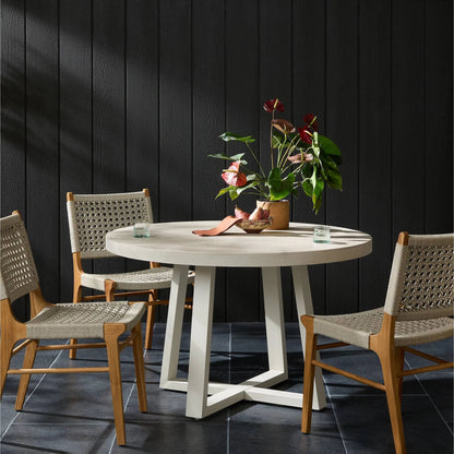 Cyrus Outdoor Round Dining Table by Four Hands. Made from lavastone composite, iron in a modern style.