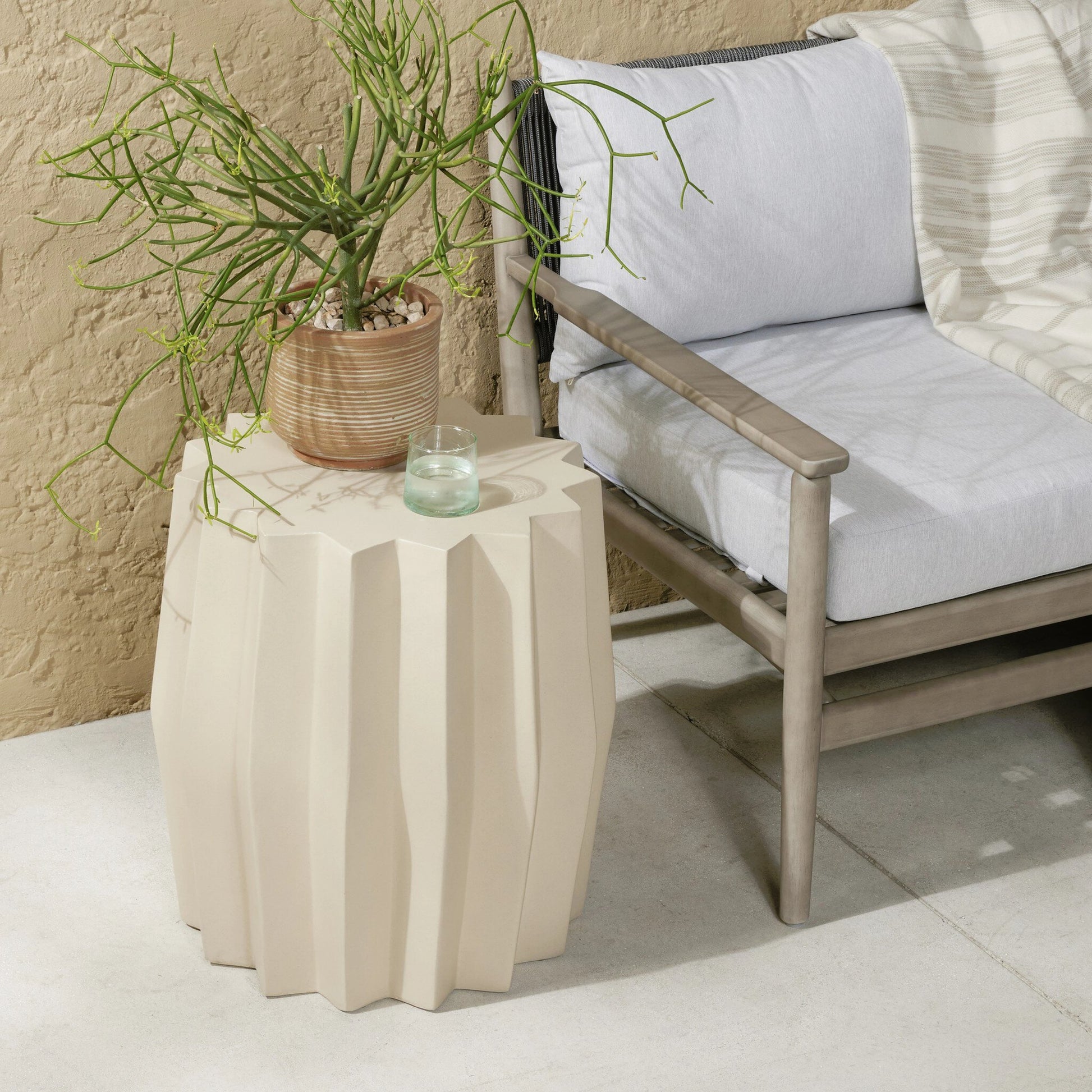 Gem Outdoor End Table by Four Hands. Made from concrete in a modern style.