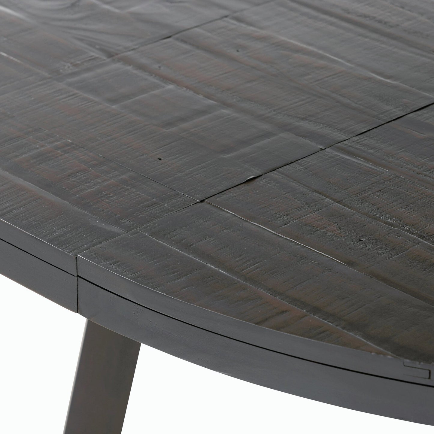 008 SI-2158148 | Closeup | Eberwin Round Ext Dining Table by Four Hands in dark carbon. Made from solid reclaimed pine in a modern style.