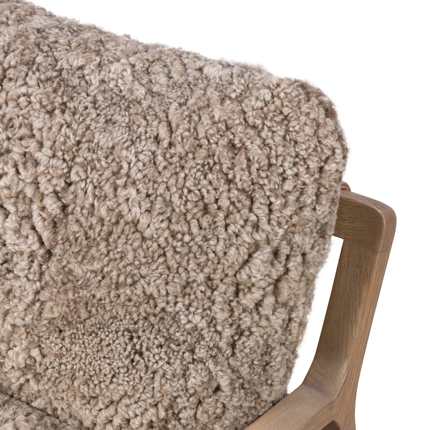 006 SI-2534739 | Closeup | Shearling Ace Chair by Four Hands in taupe shearling, drifted oak, palermo cigar. Made from shearling, solid oak, top grain leather in a unique style.