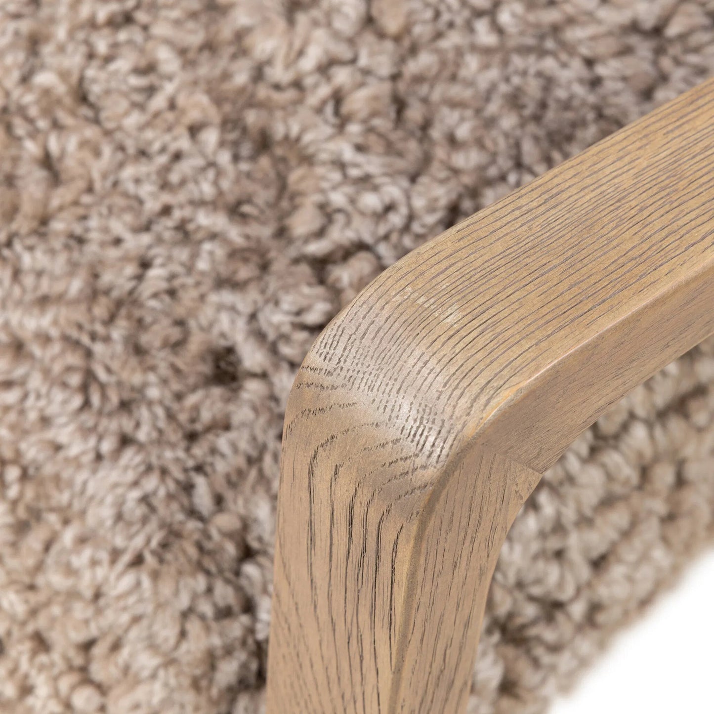 008 SI-2534739 | Closeup | Shearling Ace Chair by Four Hands in taupe shearling, drifted oak, palermo cigar. Made from shearling, solid oak, top grain leather in a unique style.