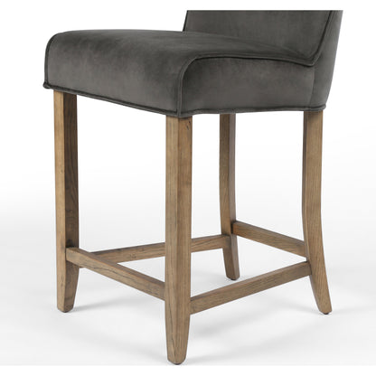 Aria Counter Stool by Four Hands in sienna chestnut. Made from top grain leather, solid nettlewood, 100% polyester in a modern style.