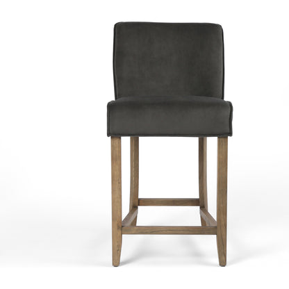 Aria Counter Stool by Four Hands in sienna chestnut. Made from top grain leather, solid nettlewood, 100% polyester in a modern style.