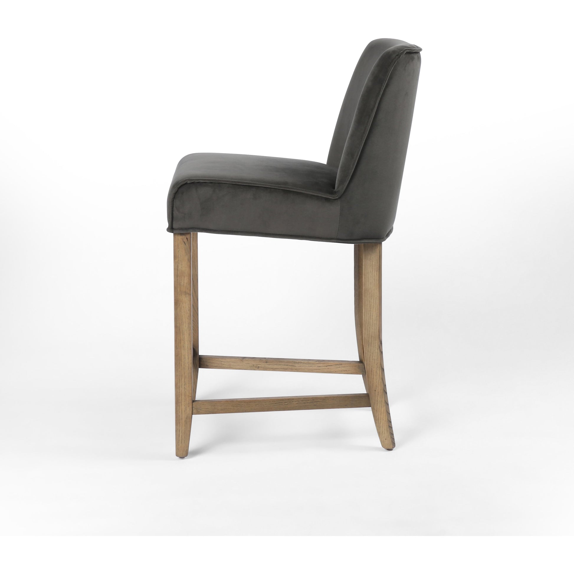 Aria Counter Stool by Four Hands in sienna chestnut. Made from top grain leather, solid nettlewood, 100% polyester in a modern style.