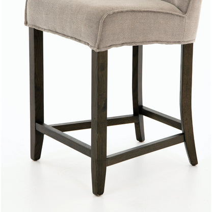 Aria Counter Stool by Four Hands in sienna chestnut. Made from top grain leather, solid nettlewood, 100% polyester in a modern style.