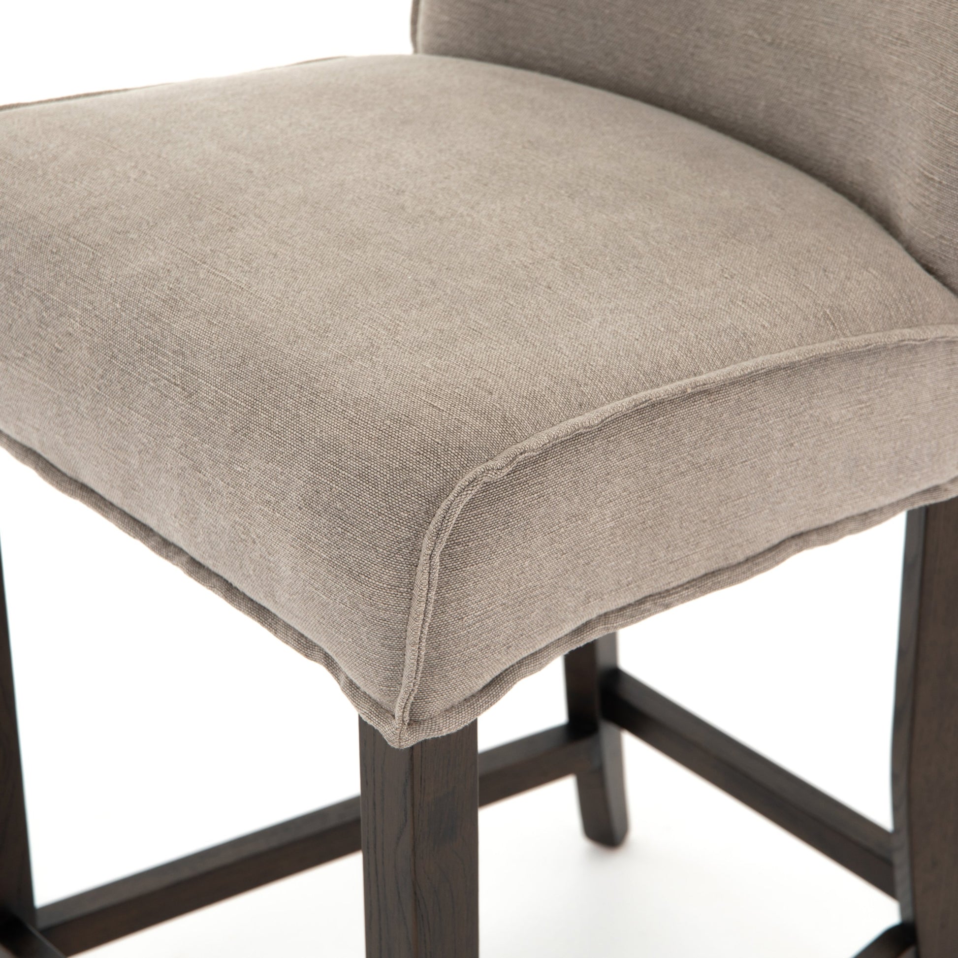 Aria Counter Stool by Four Hands in sienna chestnut. Made from top grain leather, solid nettlewood, 100% polyester in a modern style.