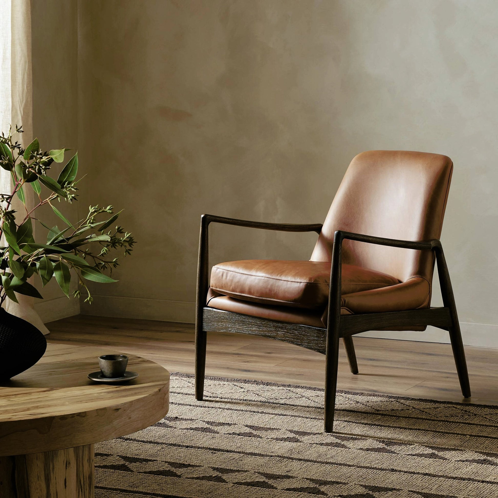 Braden Chair by Four Hands. Made from top grain leather, solid oak, 100% polyester in a modern style.
