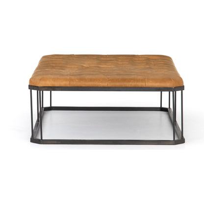 Isle Leather Ottoman by Four Hands in palermo butterscotch and aged bronze. Made from top grain leather, iron, 90% polyurethane foam, 10% fiber in a modern style.