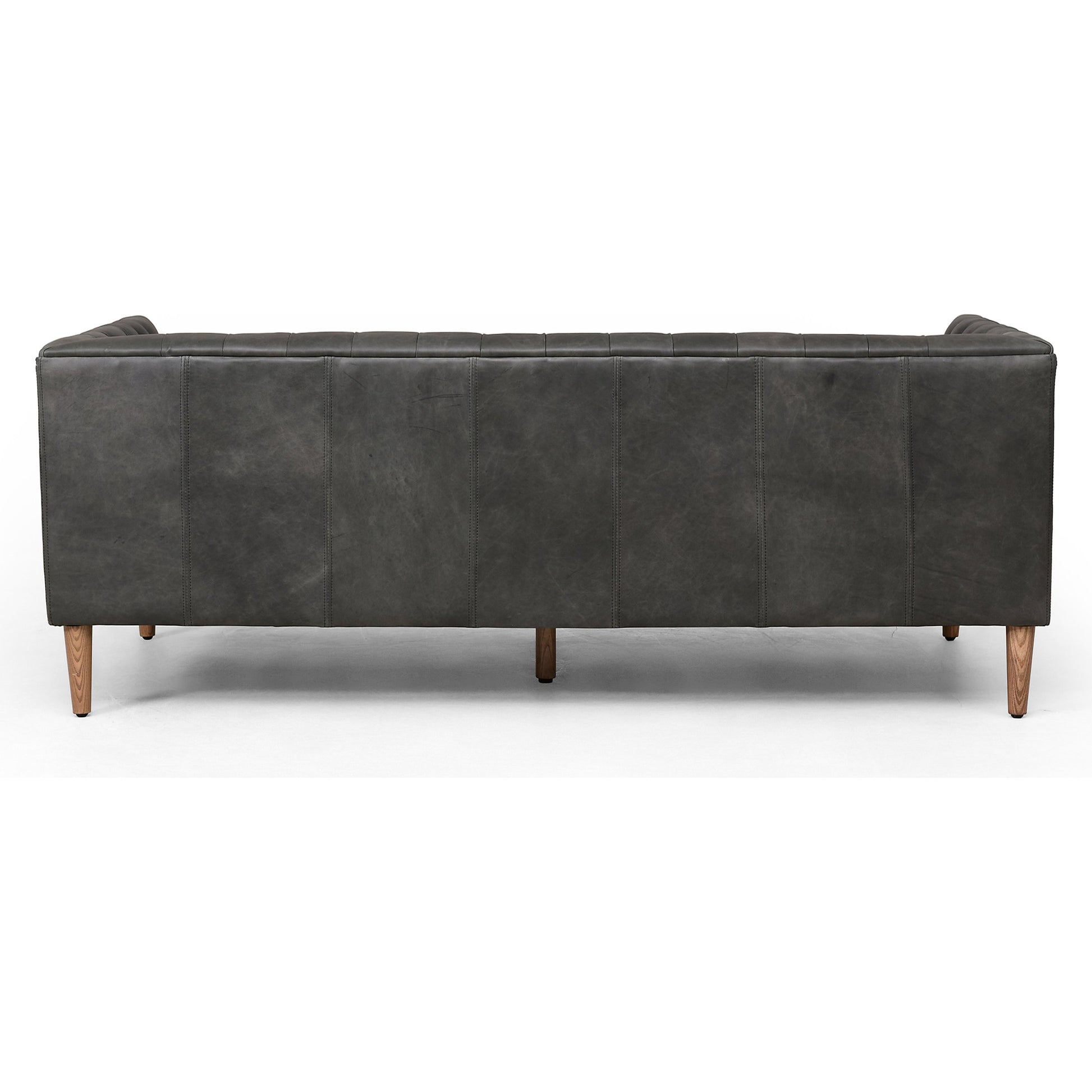 Williams Leather Sofa by Four Hands. Made from top grain leather, solid ash, 100% polyester in a rustic style.