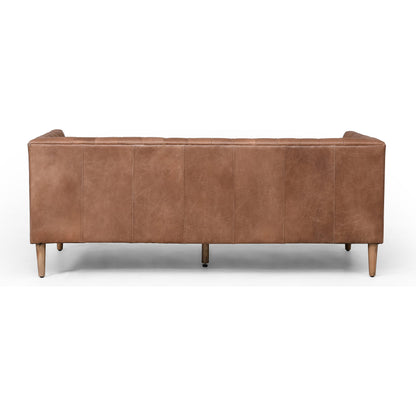 Williams Leather Sofa by Four Hands. Made from top grain leather, solid ash, 100% polyester in a rustic style.
